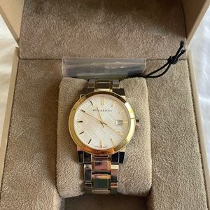 Burberry The City silver and gold women’s watch.